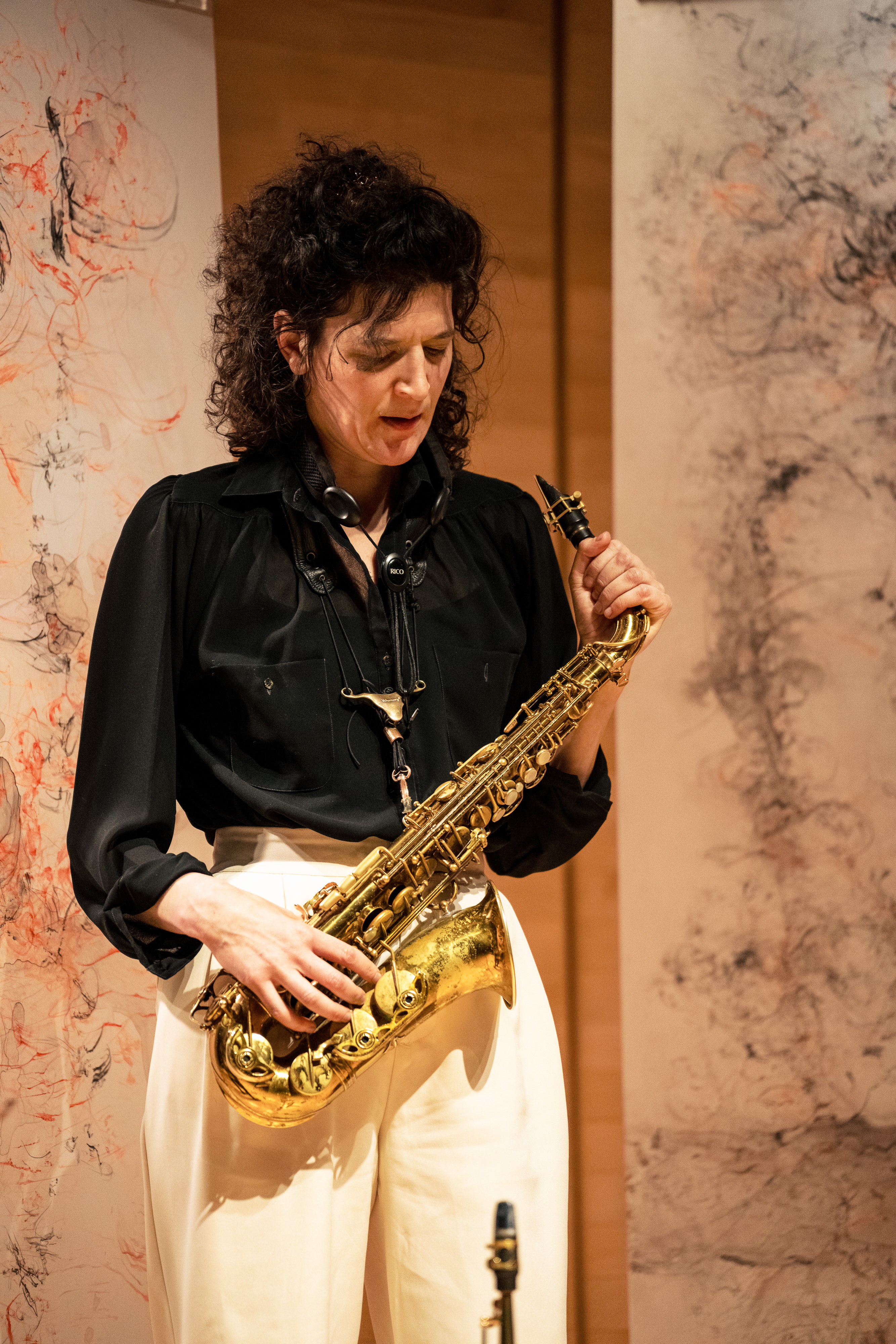 Woman standing with saxaphone